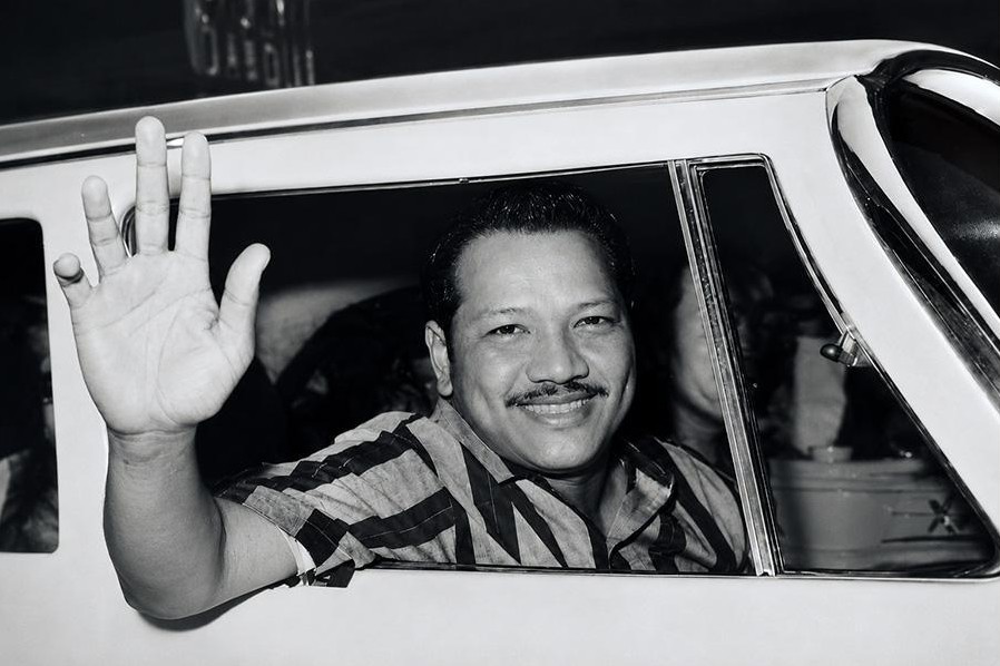 P. Ramlee waving from a car