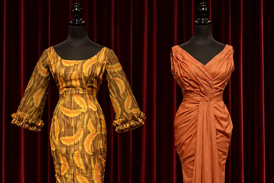 Two of Saloma's embellished stage dresses displayed on mannequins